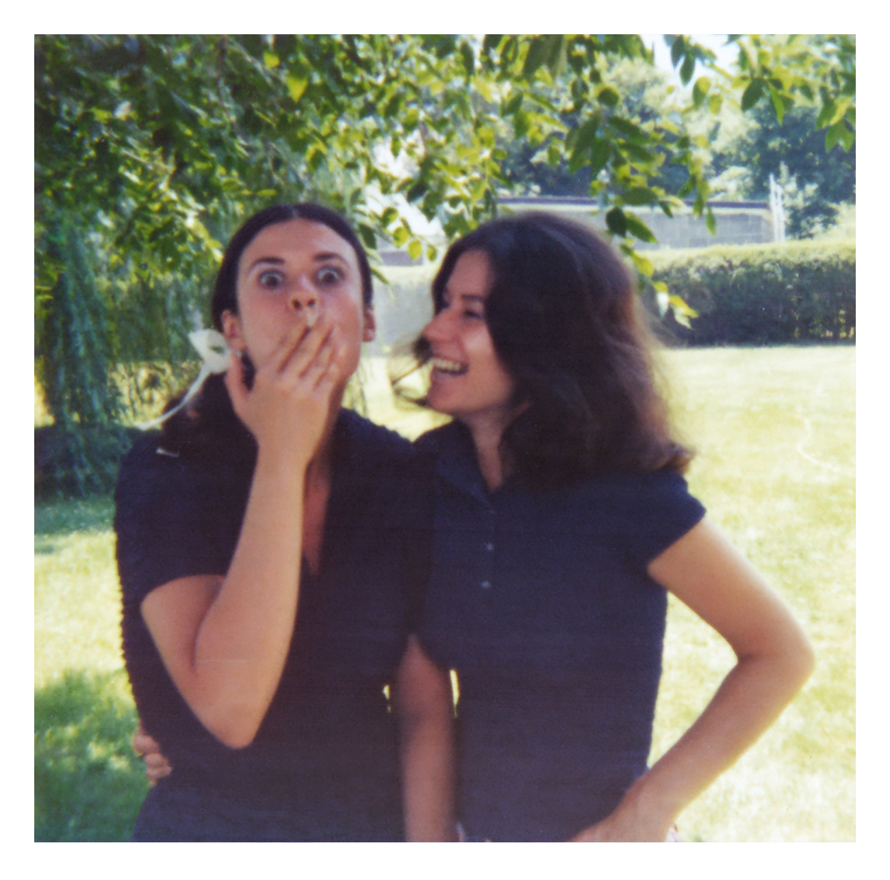 Restored two friends laughing in a park